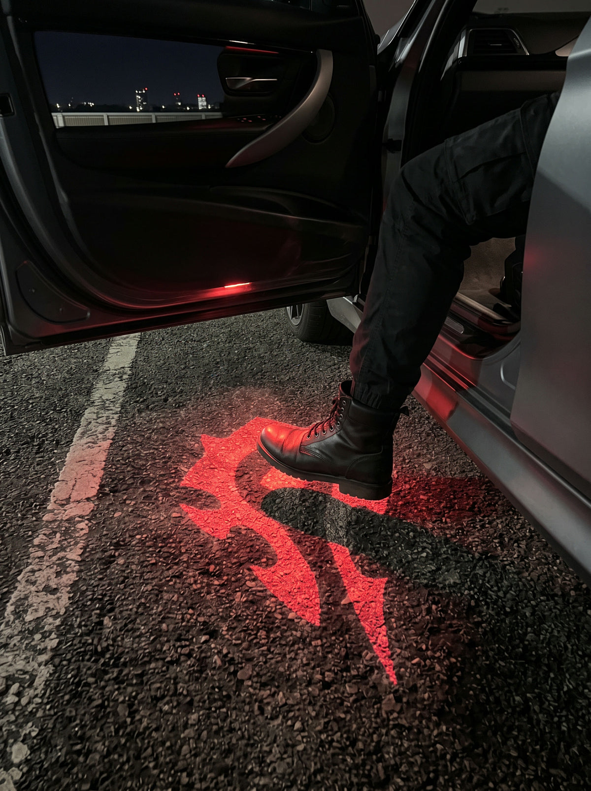 Stepping out of a car onto the projected red Horde crest