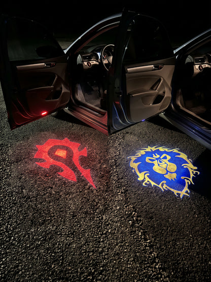 Horde and Alliance crests projected under two doors of the same car